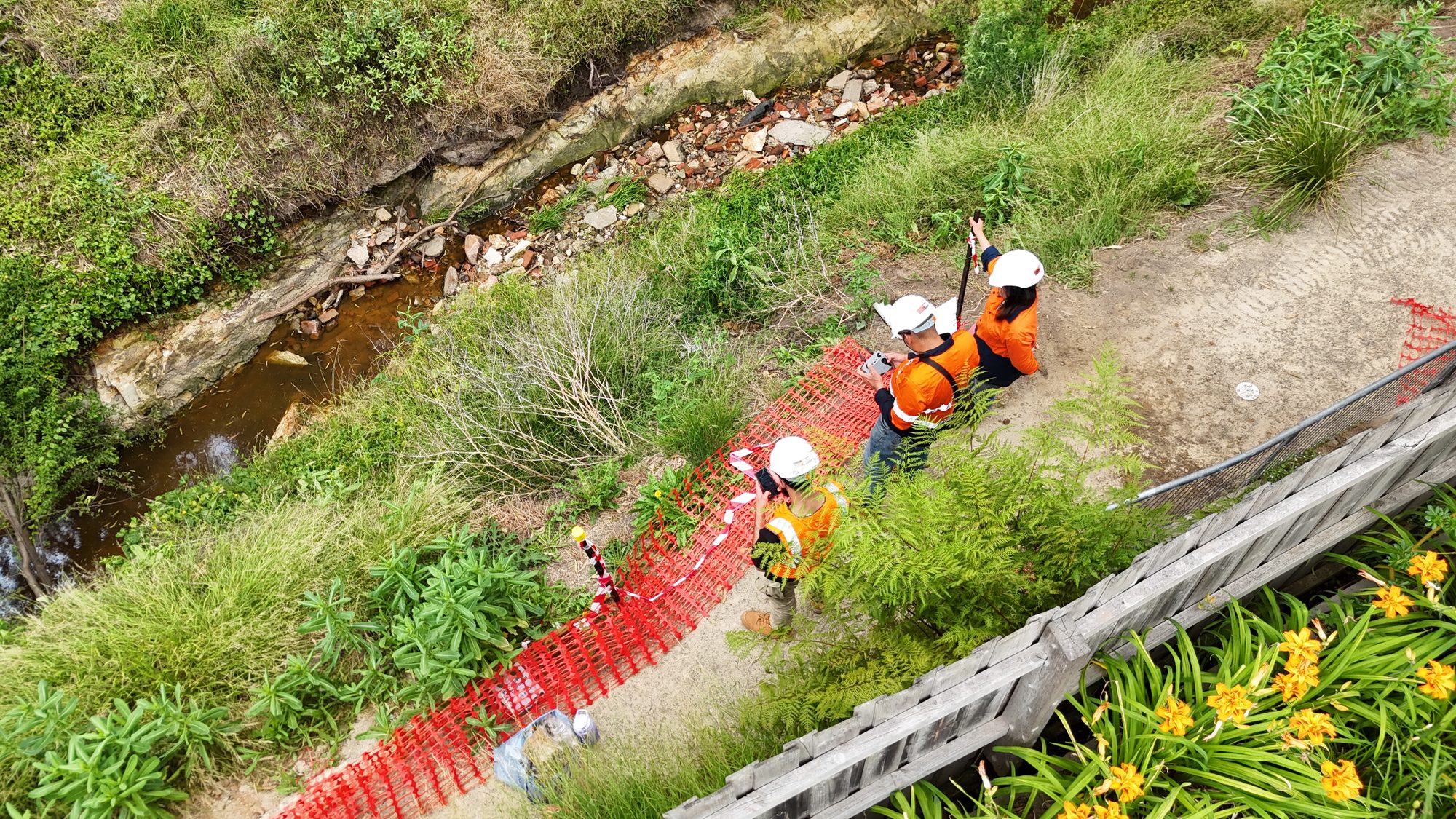 Geoporte engineers assessing a collapsed creek bank