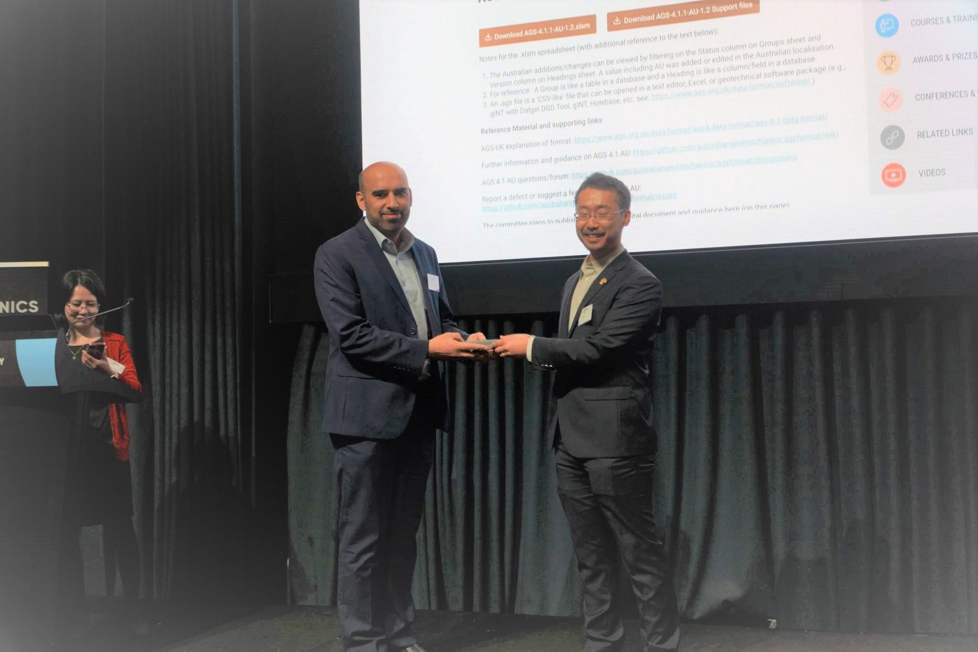 Accepting an award at an Australian Geomechanics Society event