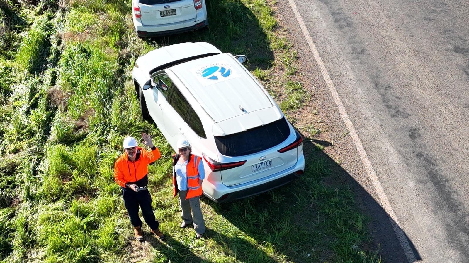 Geoporte team waving to the drone